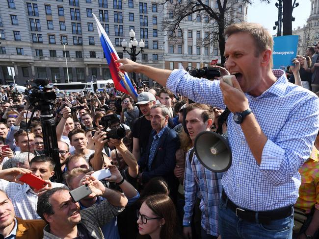 Russian opposition leader Alexei Navalny addresses supporters during an anti-Putin rally in Moscow, two days ahead of Vladimir Putin's inauguration for a fourth Kremlin term. Navalny is in a coma from suspected poisoning. Picture: AFP