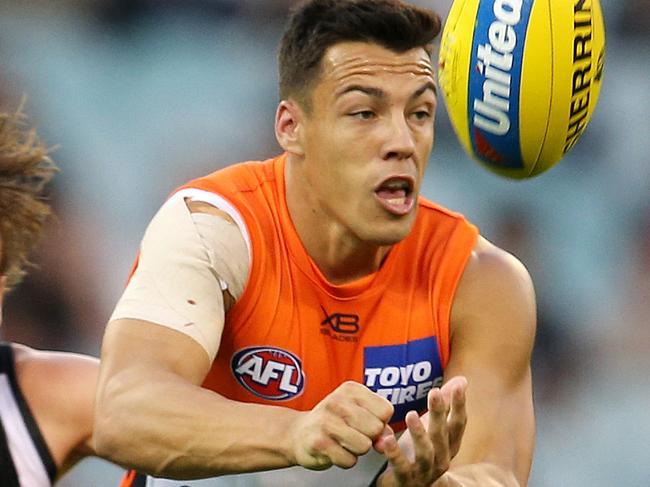 Collingwood v Greater Western Sydney at the MCG. GWS Giants Dylan Shiel clears as he is tackled by Collingwood's Callum Brown  . Pic: Michael Klein