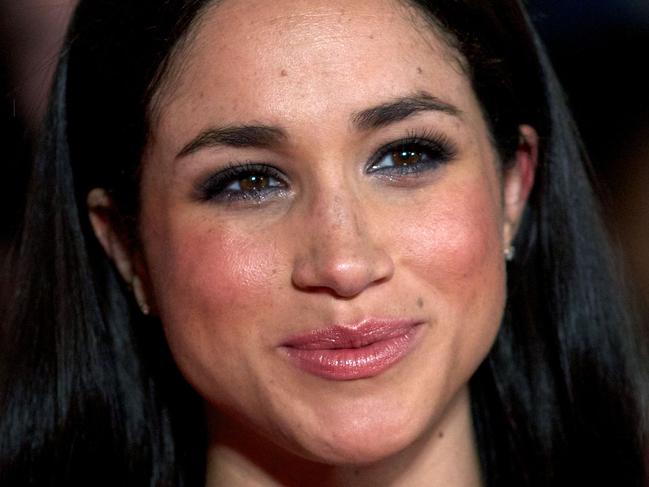 (FILES) This file photo taken on November 11, 2013 shows US actress Meghan Markle as she poses for pictures on the red carpet upon arrival for the world premier of the film 