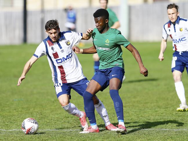 Tasmania’s Joffrey Nkoso, right, challenges Jerry Skotadis during a match against A-League club Central Coast in 2019. Picture: MATT THOMPSON