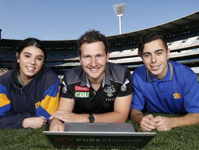 A campaign promoting STEM (science, technology, engineering and maths) has released a careers guide showing the interesting jobs that can come out of studying "boring" subjects. Collingwood Football Club's data analyst Daniel Pelchen with students Olivia Basile 16, and Daniel Soumelidis 16, from St Monica's college starting at the grass roots level on the MCG ground.     Picture: David Caird