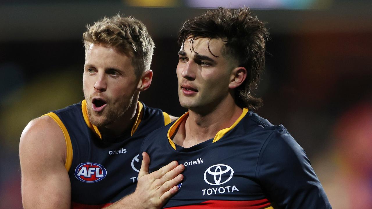 Rory Sloane tries to calm down Josh Rachele during a fiery clash against the Giants. Picture: Sarah Reed/AFL Photos via Getty Images