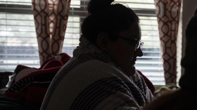 Esperanza Gonzalez wraps herself in a blanket to stay warm in her apartment during power outages caused by the winter storms in Texas on February 16. Picture: