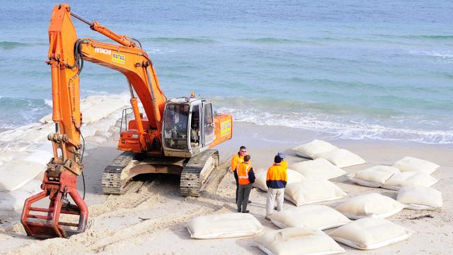 Sandbag groynes being installed at Somerton Park in 2008 to prevent sand drift and widen the beach.