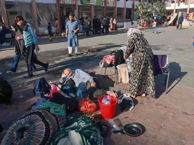 Displaced Palestinians set up shelters in the courtyard of a government-run school in Rafah in the southern Gaza Strip amid continuing battles between Israel and the militant group Hamas. Picture: AFP