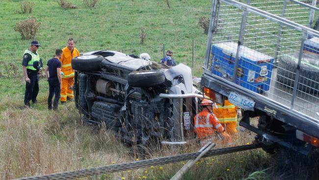 ELECTION TEAM 2022 LIBERAL BUS TOUR 14/4/2022 3 occupants crash their car and roll on the road to Davenport from Launceston Tasmania. Picture: Jason Edwards