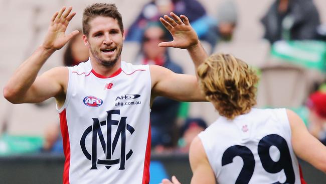 Jesse Hogan celebrates a goal for Melbourne.