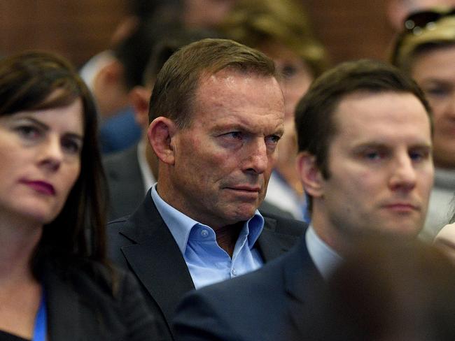 Mr Abbott watches as Prime Minister Malcolm Turnbull delivers his address at the 59th Liberal Party Federal Council Meeting in Sydney on Saturday. Picture: Dan Himbrechts