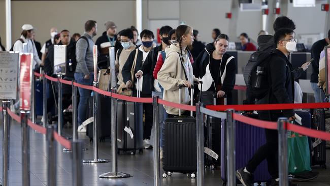 Travellers queue up to check in at Sydney Airport’s T2 domestic terminal. Picture: John Appleyard