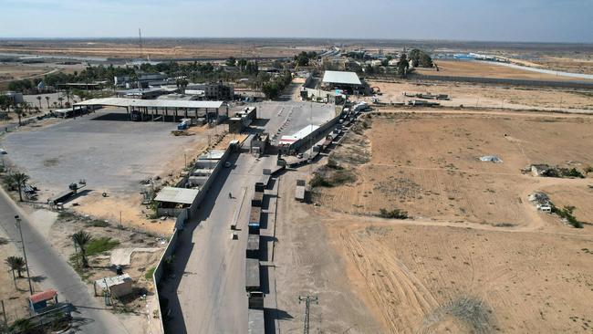 An aerial view of a convoy of trucks carrying humanitarian aid enters the Gaza Strip from Egypt via the Rafah border crossing. Picture: AFP