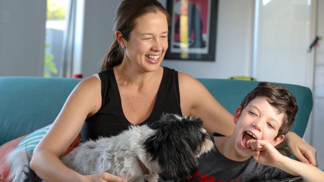 Michaela Banks at home with son Harry, 6, and their dog, Thuvi. Picture: AAP/Russell Millard