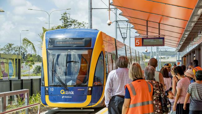 Opening morning of the Stage 2 of the Gold Coast light rail (g:link). The crowds wait as the light rail tram enters the station at Helensvale. Picture: Jerad Williams