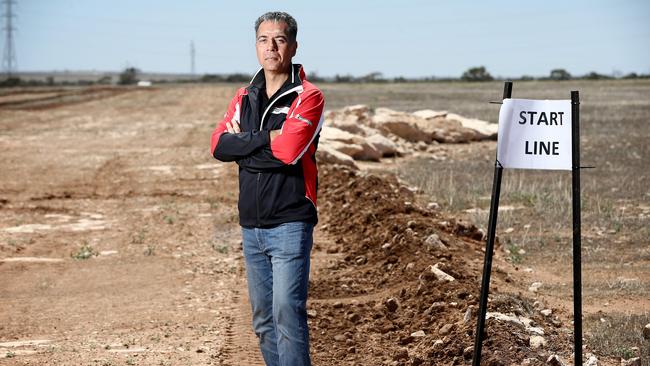 Sam Shahin at the start/finish line of the motorsport park during construction. Picture: Mike Burton