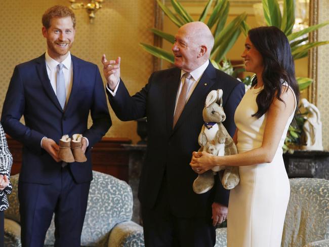 Australia's Governor General Peter Cosgrove gives the Duke and Duchess of Sussex a toy kangaroo - with a baby - at Admiralty House on Tuesday. Picture: Phil Noble/AP