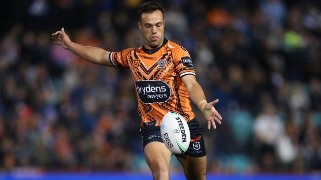 Luke Brooks takes a punt. Photo by Jason McCawley/Getty Images.