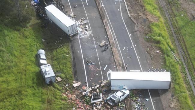 An aerial photo of the devastating scene in which at least three people have died in a five vehicle crash on the Bruce Highway near Maryborough. Picture: Michael O'Connor