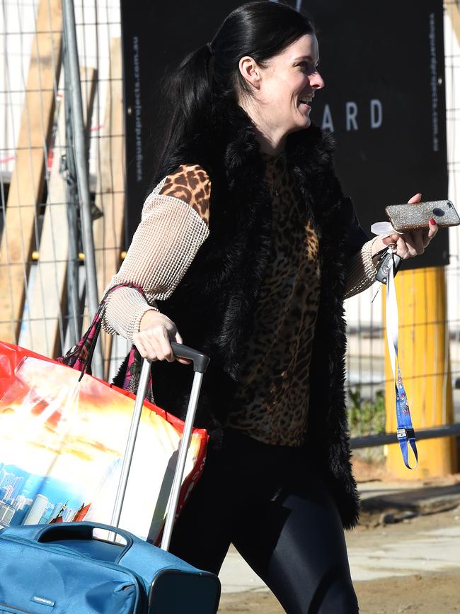 Amber Harrison wheels her luggage to her house in Melbourne on the day her matter appeared in court. Picture: Nicole Garmston