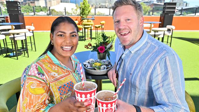 SACA members John Hinge and Hannah Douglas-Hill enjoy Pimms and oysters on the new Village Green for members at the Lindsay Head Terrace on Level 5 of Adelaide Oval’s Riverbank Stand. Picture: Brenton Edwards