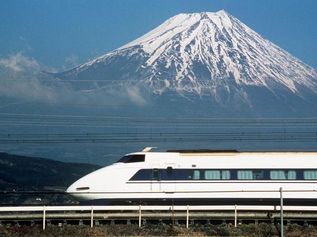 Undated : Bullet train railway in front of Mount (Mt) Fuji, Japan.