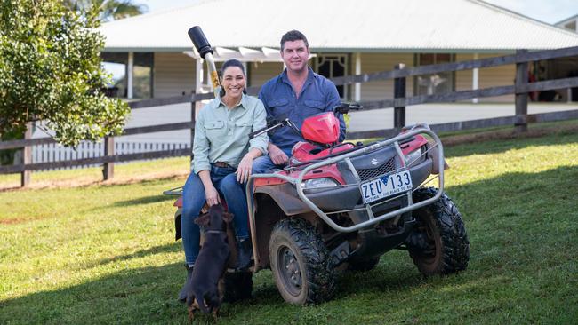 Giaan Rooney, husband Sam Levett and dog Roy on their farm. Picture: Danielle Smith