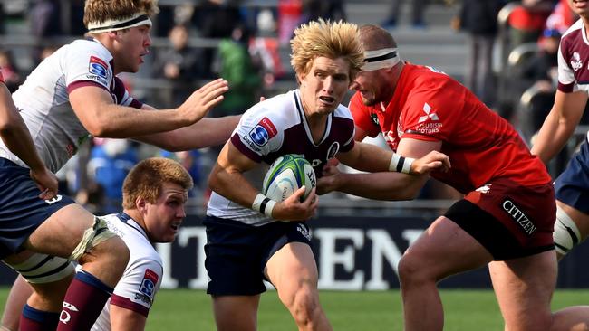 Tate McDermott carries the ball against the Sunwolves. Picture: AFP