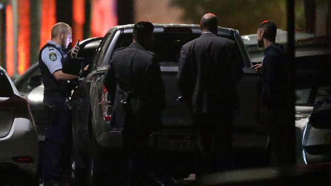 Police gather on Euston Lane in Alexandria where two police officers were injured in relation to the arrest of four men. Picture: Jonathan Ng