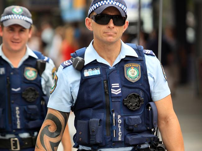 AFP Police officers forced to hide tattoos under new uniform rules | Daily  Telegraph