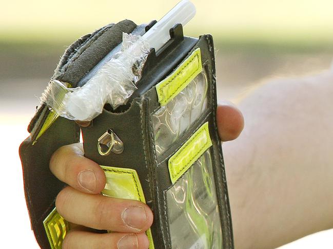 Police conducting Breathalyser tests. Breath testing. Booze bus