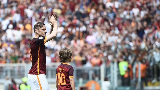 Francesco Totti applauds the crowd.