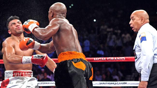 Victor Ortiz (left) after being hit with a right from Floyd Mayweather. Photo: AFP