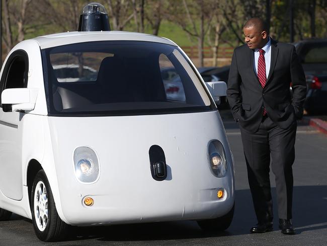 US Transportation Secretary Anthony Foxx inspects a Google self-driving car in California. Picture: Justin Sullivan/Getty Images/AFP