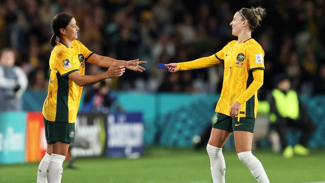 Sam Kerr receives the captain's armband from Steph Catley aginst Denmark. Pictures: Getty Images.