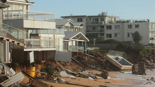 The properties on Pittwater rd north of Ramsay st Collaroy have suffered more errossion overnight. .Police Guard a large stretch of the Collaroy coastline after the weekend storms .pic John Grainger