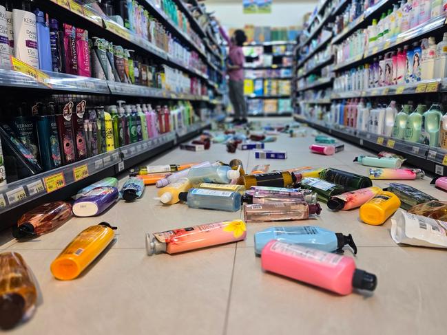 This photo taken by Taiwan's Central News Agency (CNA) on April 3, 2024 shows bottles strewn on the floor of a supermarket in Yilan, after a major earthquake hit Taiwan's east. A major 7.4-magnitude earthquake hit Taiwan's east on the morning of April 3, prompting tsunami warnings for the self-ruled island as well as parts of southern Japan and the Philippines. (Photo by CNA / AFP) / Taiwan OUT - China OUT - Macau OUT / Hong Kong OUT RESTRICTED TO EDITORIAL USE