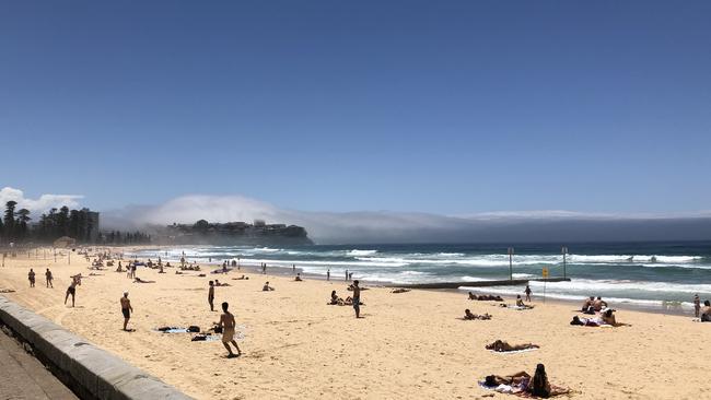 The fog at Manly Beach at 1.30pm on Monday. Picture: Robbie Patterson.