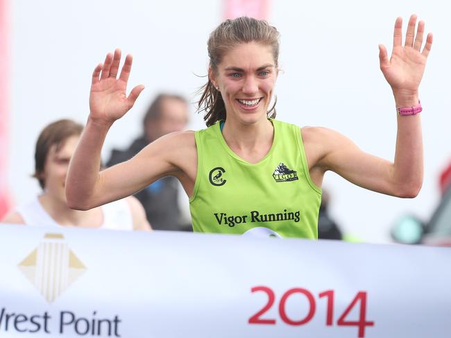 Virginia Moloney 24 of Garvoc Victoria crosses the line first in the women's running event. Point to Pinnacle run and walk from Wrestpoint Casino to the top of Mount Wellington.