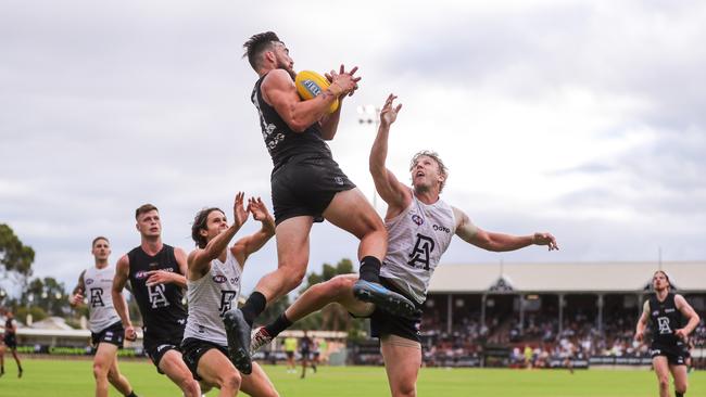 Charlie Dixon marks the ball over Trent McKenzie during Port Adelaide’s 2020 internal trial on Friday night. Picture: Matt Turner/AFL Photos via Getty Images