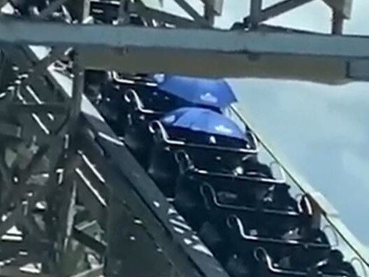 Those stuck on the ride were given umbrellas to shield them from the sun.