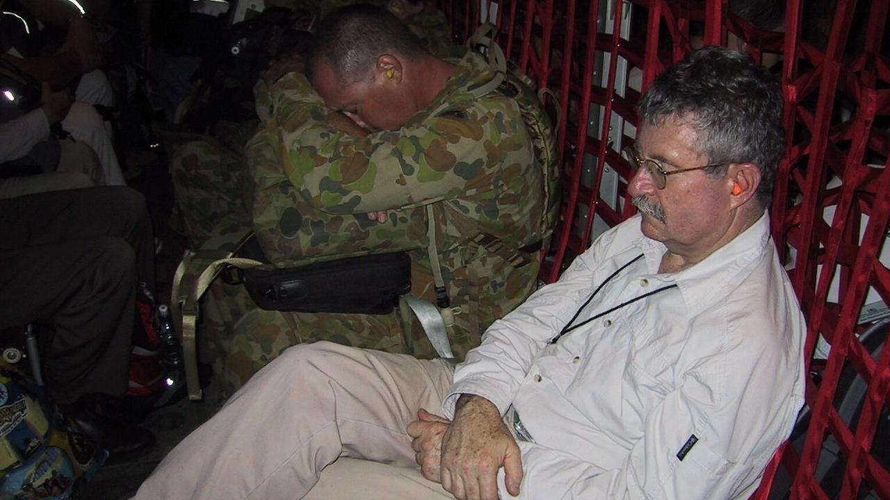 Orthapaedic surgeon Rob Atkinson on an RAAF C-130. Picture: Supplied