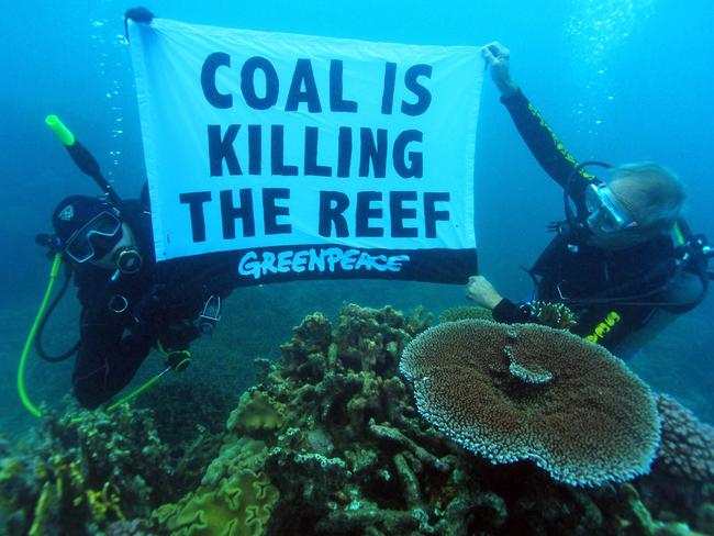 Coral scientist Dr John 'Charlie' Veron dives for an underwater protest in the Great Barrier Reef. Picture: Supplied