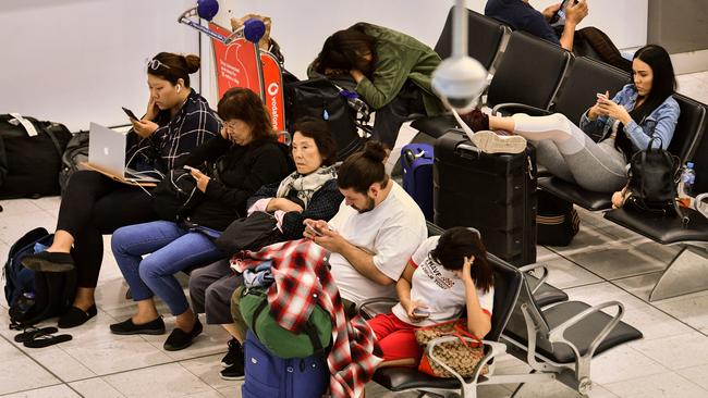 Passengers wait for flights. Picture: AAP/Brendan Esposito