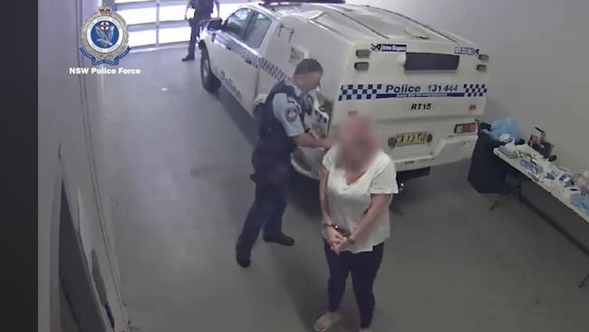 Marks, being taken inside Raymond Terrace police station after being arrested over the screwdriver stabbing at Nelson Bay on May 13, 2022. Picture: NSW Police.