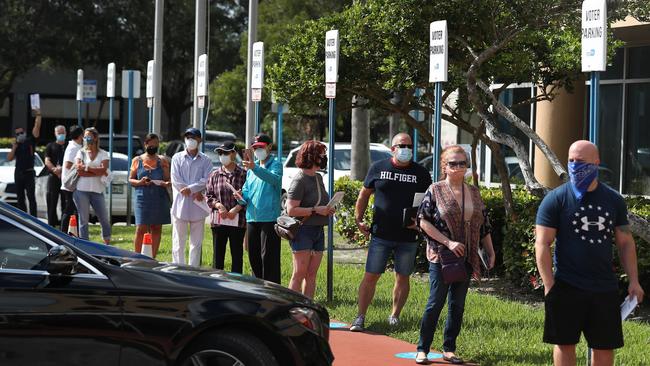 Voters wait in line to drop off their vote-by mail ballots in Miami. Picture: AFP