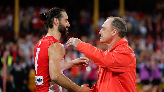 SYDNEY, AUSTRALIA - SEPTEMBER 20: Brodie Grundy of the Swans and John Longmire, Senior Coach of the Swans are seen during the 2024 AFL First Preliminary Final match between the Sydney Swans and the Port Adelaide Power at The Sydney Cricket Ground on September 20, 2024 in Sydney, Australia. (Photo by Dylan Burns/AFL Photos via Getty Images)