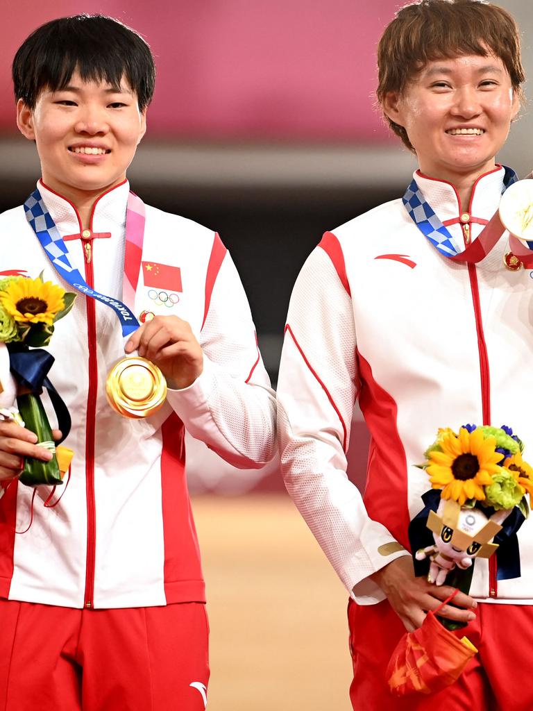 Gold medallists China's Bao Shanju and China's Zhong Tianshi pose with their medals on the podium. Picture: Peter PARKS / AFP