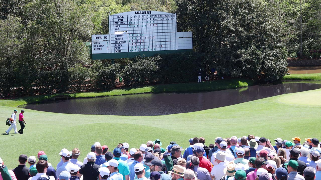 Tiger Woods walks to the 11th green during the first round of the Masters.