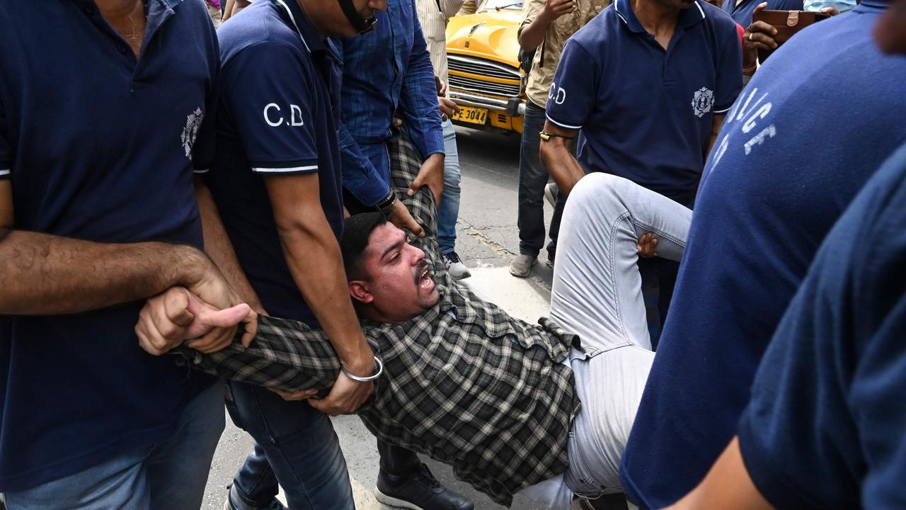 A Congress party activist shouts slogans while being detained by police in Kolkata. Picture: Dibyangshu Sarkar/AFP