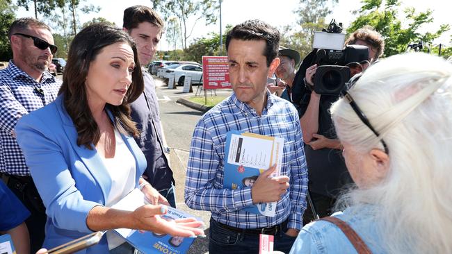 Leader of the Opposition David Crisafulli handed out how to vote cards with Bianca Stone in the seat of Gaven. Picture: NewsWire/ Liam Kidston