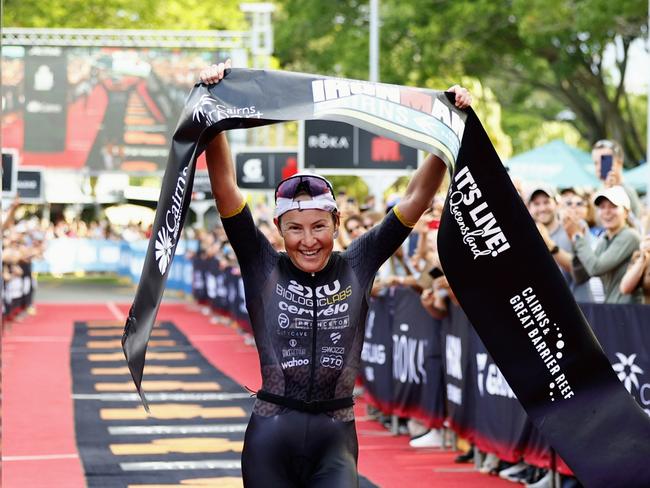 Kylie Simpson crosses the finish line on the Cairns Esplanade to win the Ironman Cairns Asia Pacific Championship race. Picture: Brendan Radke