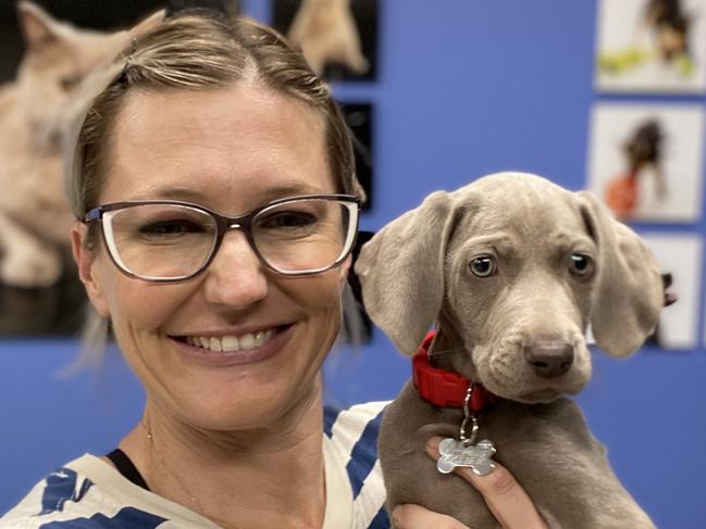 Amy Smith, 40, of Mona Vale, with one of the puppies she is training. Picture: Supplied.